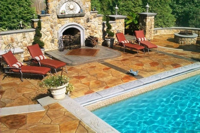 Design ideas for a large mediterranean back swimming pool in Baltimore with concrete slabs.