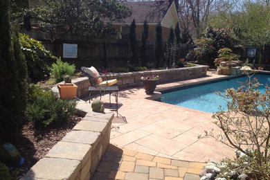 Pool - large traditional backyard concrete paver and rectangular lap pool idea in Other