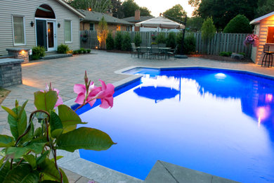 Minimalist backyard custom-shaped pool photo in Toronto