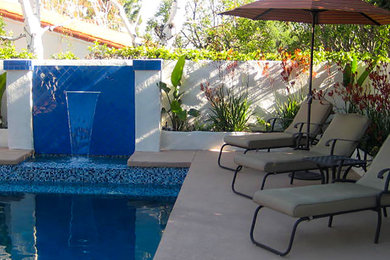 Pool fountain - mid-sized traditional backyard concrete and l-shaped aboveground pool fountain idea in Los Angeles