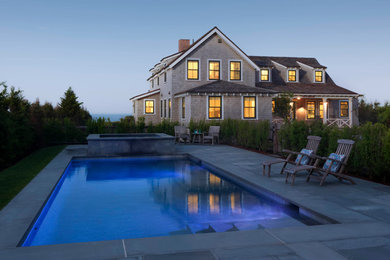 Inspiration for a coastal backyard stone and rectangular lap hot tub remodel in Boston