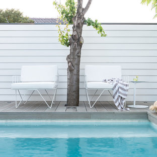 Design ideas for a small beach style backyard pool in Perth with decking.