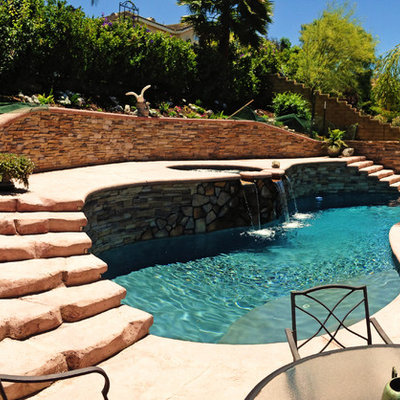 Inspiration for a mid-sized mediterranean backyard stamped concrete and custom-shaped aboveground pool remodel in Los Angeles