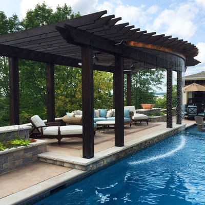 Pool fountain - transitional backyard concrete and rectangular lap pool fountain idea in Milwaukee