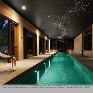This is an example of an asian backyard rectangular pool in Perth with tile.