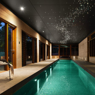 Mid-sized asian indoor rectangular pool in Perth with concrete slab.