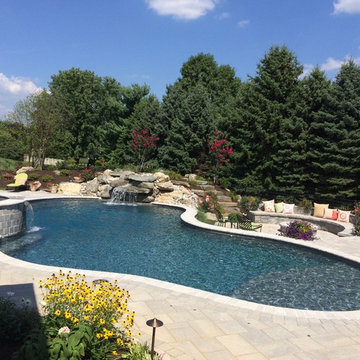 Bethlehem Township pool and spa with waterfall and sunshelf