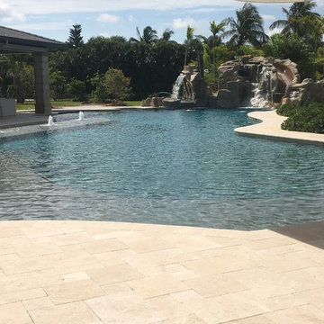 Big Custom Pool with a Rock Waterfall and Slide in Boca Raton