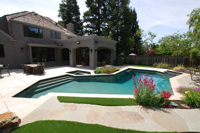 Inspiration for a huge contemporary backyard stamped concrete and custom-shaped hot tub remodel in San Francisco