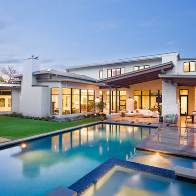Inspiration for a huge contemporary backyard rectangular and tile lap hot tub remodel in Austin