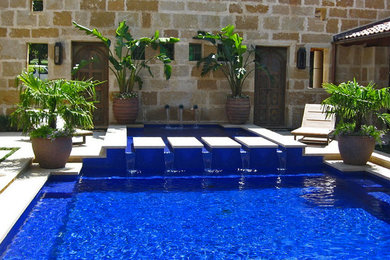 Blue glass tile swimming pool