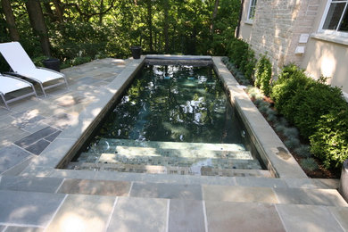 Inspiration for a mid-sized contemporary backyard rectangular and tile lap pool remodel in Columbus