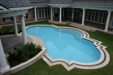 Inspiration for a timeless custom-shaped pool remodel in Austin