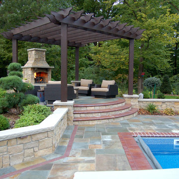 Bluestone pool decks, arbors, fireplaces, outdoor kitchen & pavilion