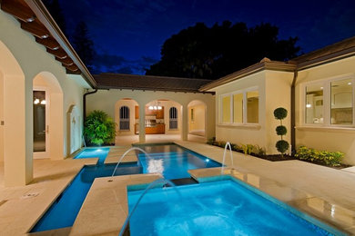 Example of a tuscan courtyard pool design in Miami