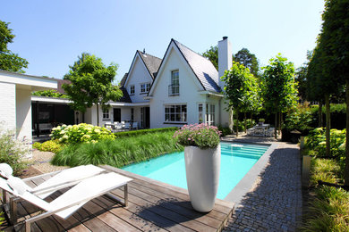 Inspiration for a mid-sized timeless backyard rectangular pool remodel in Amsterdam