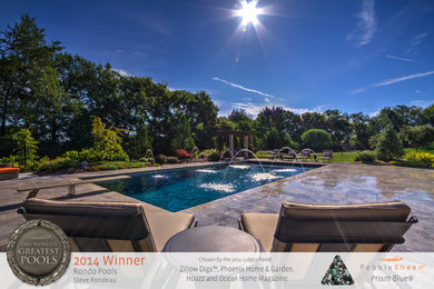 Inspiration for a large timeless backyard stone and rectangular pool remodel in Nashville