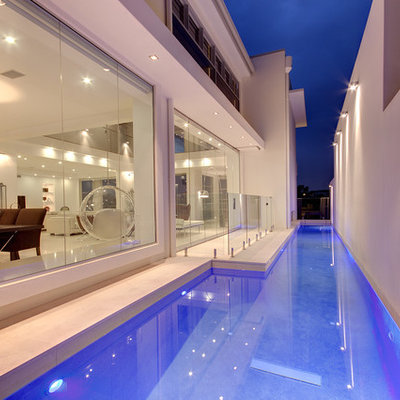 Mid-sized minimalist stone and rectangular lap pool photo in Brisbane