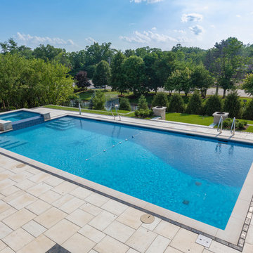 Burr Ridge Lap Pool with Raised Hot Tub and Waterfall