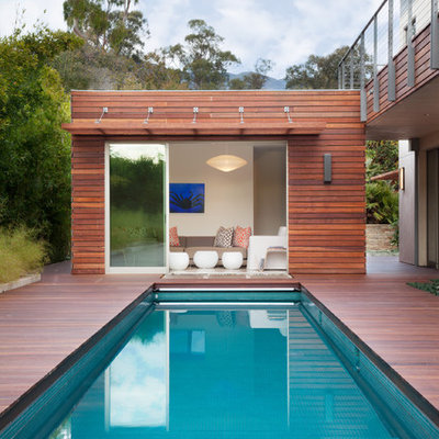 Mid-sized trendy backyard rectangular lap pool house photo in Santa Barbara with decking