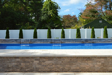 Pool - traditional backyard brick and custom-shaped aboveground pool idea in New York