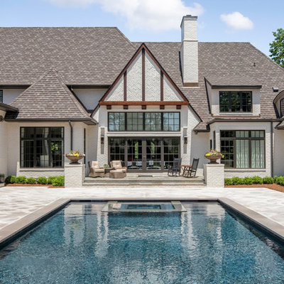 Inspiration for a large country backyard tile and rectangular hot tub remodel in Charlotte