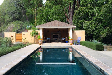 Inspiration for a large craftsman backyard concrete paver and rectangular lap pool house remodel in San Francisco