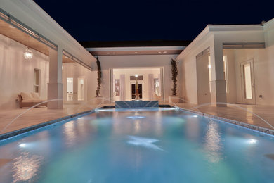 Pool - large contemporary backyard rectangular lap pool idea in Miami