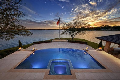 Inspiration for a large contemporary infinity pool remodel in Detroit
