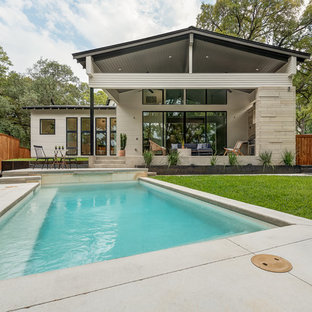 Design ideas for a small scandinavian backyard rectangular pool in Austin with concrete slab.