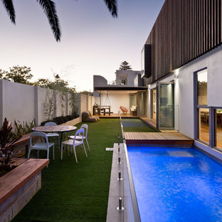 Contemporary backyard rectangular lap pool in Perth with decking.