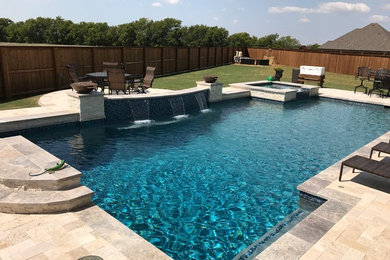 Pool - large contemporary backyard rectangular pool idea in Dallas