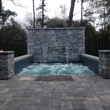 Cocktail Pool With Fountains and Fire Features