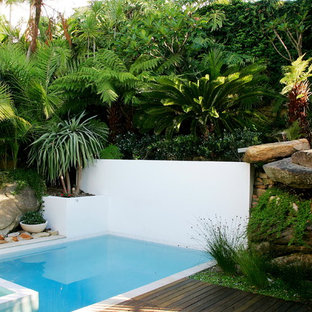 Photo of a contemporary rectangular pool in Sydney with a hot tub and decking.