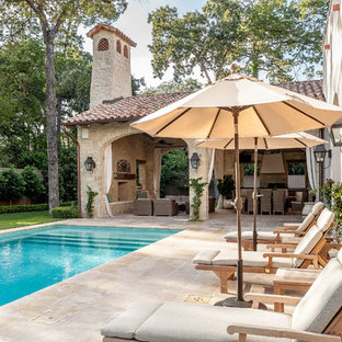 Photo of a medium sized mediterranean back rectangular lengths swimming pool in Houston with natural stone paving.