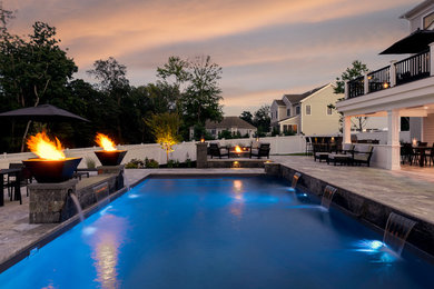 Pool fountain - large contemporary backyard concrete paver and rectangular lap pool fountain idea in Boston