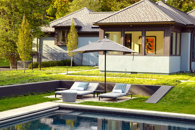Inspiration for a huge contemporary backyard concrete and rectangular pool remodel in New York