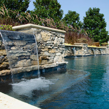 Contemporary-style Pool with Spillover Spa & Water Features