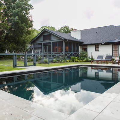 Example of a mid-sized trendy backyard concrete paver and rectangular pool house design in Charleston
