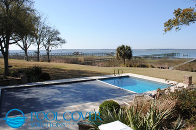 Large elegant backyard stone and rectangular pool photo in Charleston