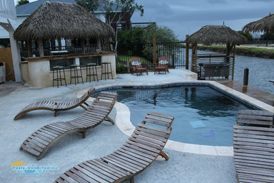 Example of a beach style pool design in Austin
