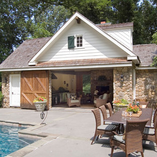 Pool house - traditional concrete pool house idea in Philadelphia