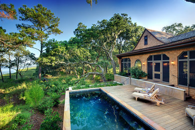 Elegant pool photo in Charleston with decking