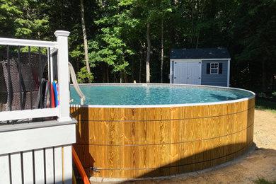 Example of a backyard round aboveground pool design in Manchester