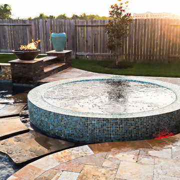 Rim Flow hot tub with natural stone steppers