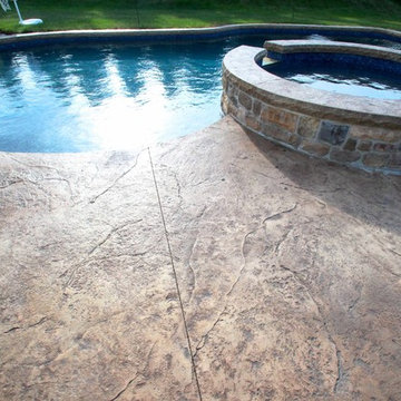 Custom Freeform salt water inground pool with raised spa