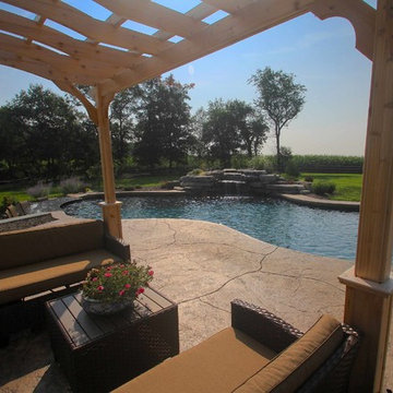 Custom Freeform style in ground salt water pool with Waterfall and Firepit