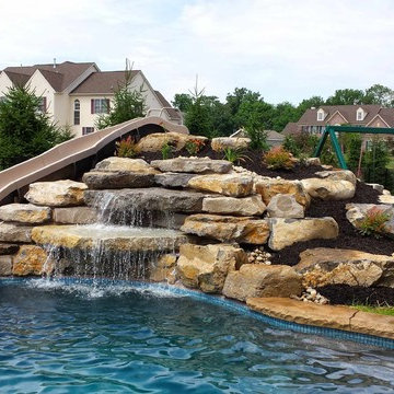 Custom Freeform style salt water inground pool with Waterfall and Pavilion