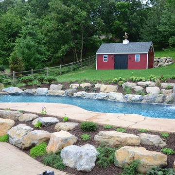 Custom Freeform style salt water pool with waterfall