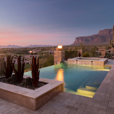 Hot tub - southwestern rectangular infinity hot tub idea in Phoenix